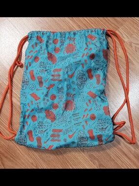 Nike Drawstring Backpack in Teal with Orange Accents